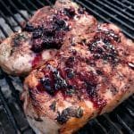 Pork chops with blackberry compote on the grill