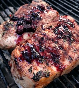 Pork chops with blackberry compote on the grill