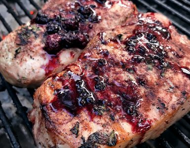 Pork chops with blackberry compote on the grill