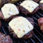 Beef sliders on the grill with Cabot's Pepper Jack Cracker Cuts