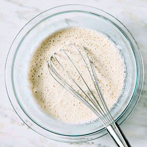 In a medium-sized bowl, whisk ice-cold beer with rice flour until very smooth and all lumps have been creamed to create tempura batter.